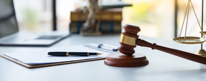 Legal documents and gavel representing illegal firearm possession charges in Tennessee