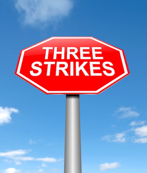 Three-Strikes Law Concept Stop Sign