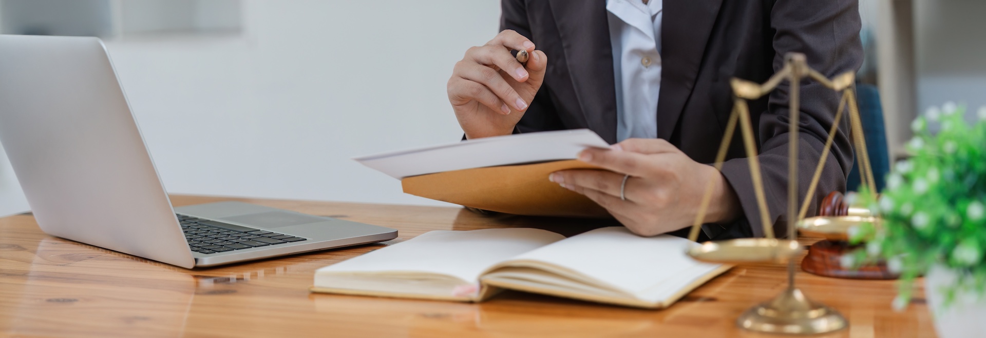 A criminal defense attorney reviewing case documents and developing common defense strategies for client representation.