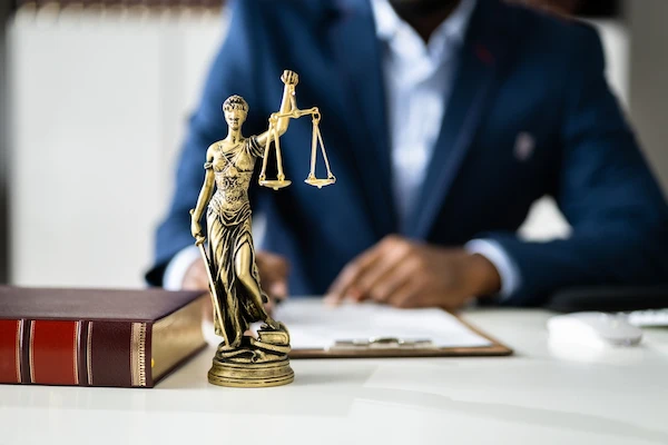 A Tennessee domestic assault lawyer at Byron Pugh Legal reads documents.