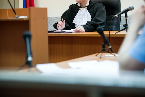 A judge reads criminal charges at a first court hearing in Tennessee.